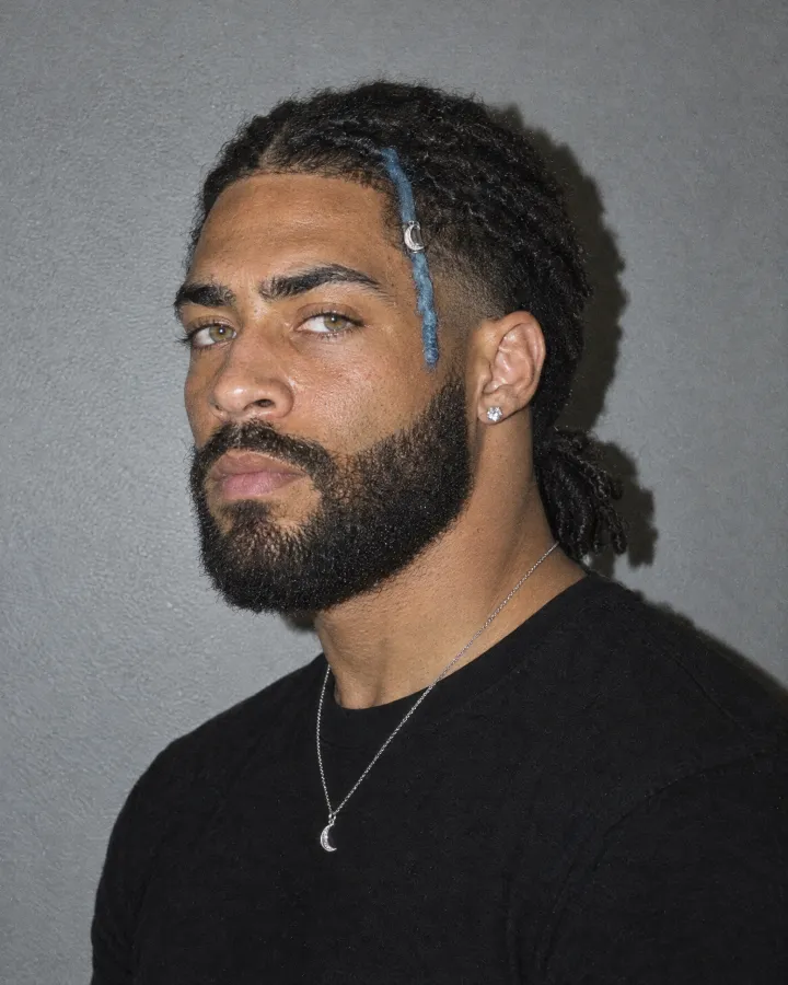 The side view, face ref 2, attached next to the headshot so his profile holds from shot to shot.
